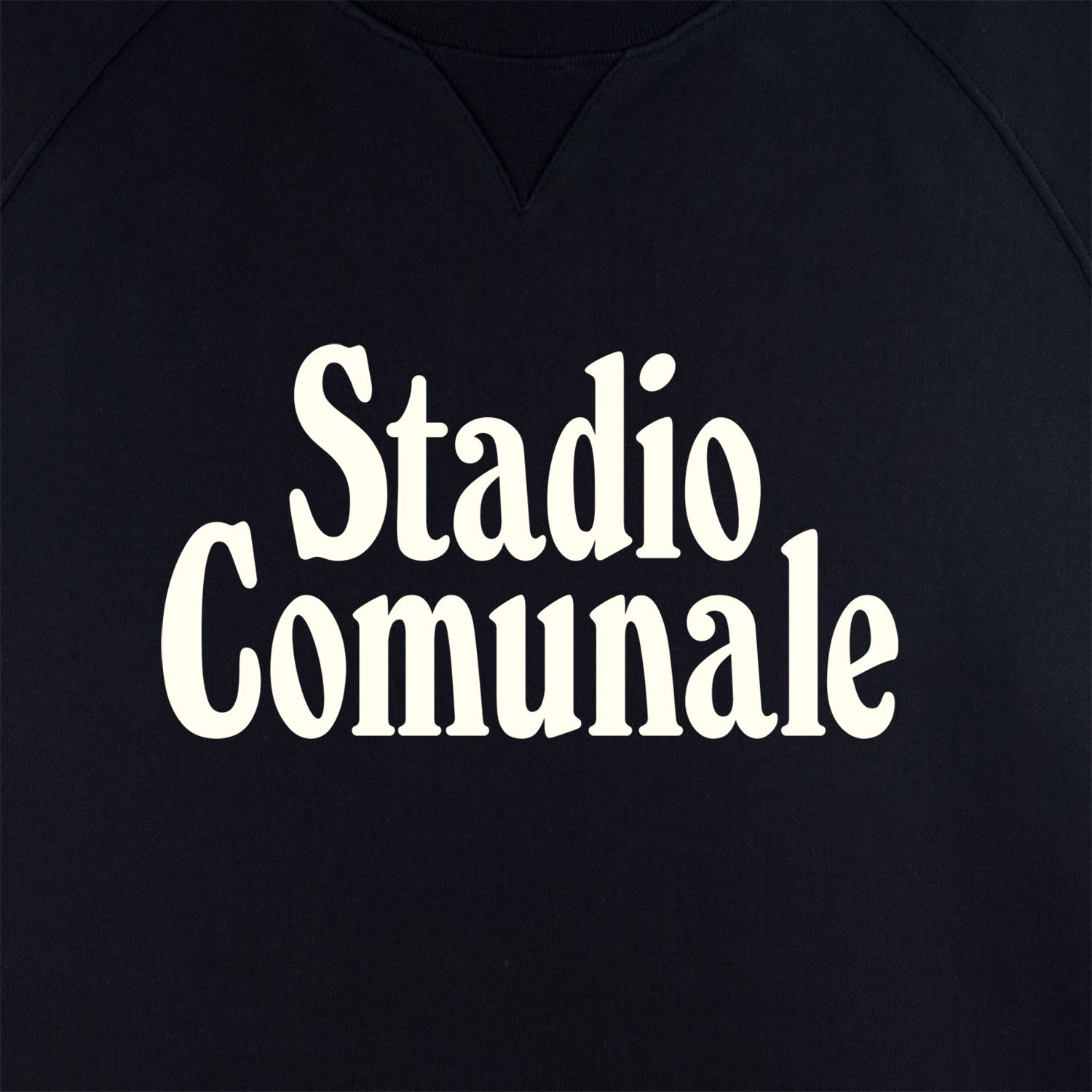 Statio Comunale print in white on black sweatshirt.