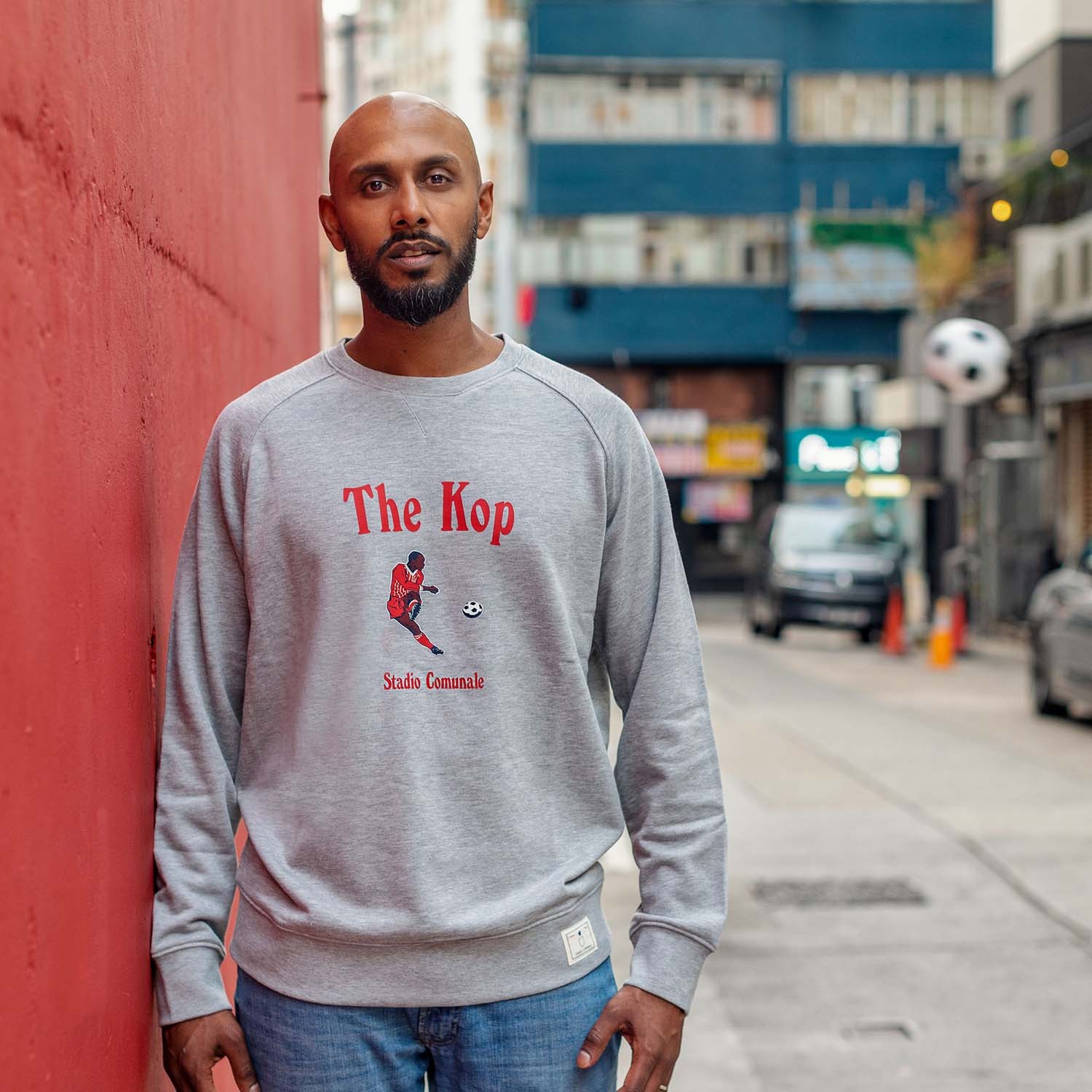 The Kop in red print for Liverpool football team.